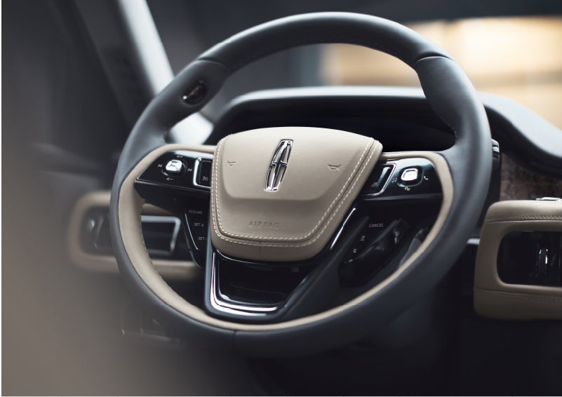 The intuitively placed controls of the steering wheel on a 2023 Lincoln Aviator® SUV | Haldeman Lincoln in Allentown PA