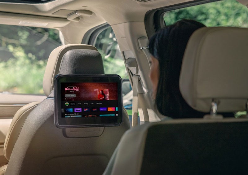 A person is seated in a 2023 Lincoln Nautilus SUV viewing an available entertainment screen. | Haldeman Lincoln in Allentown PA