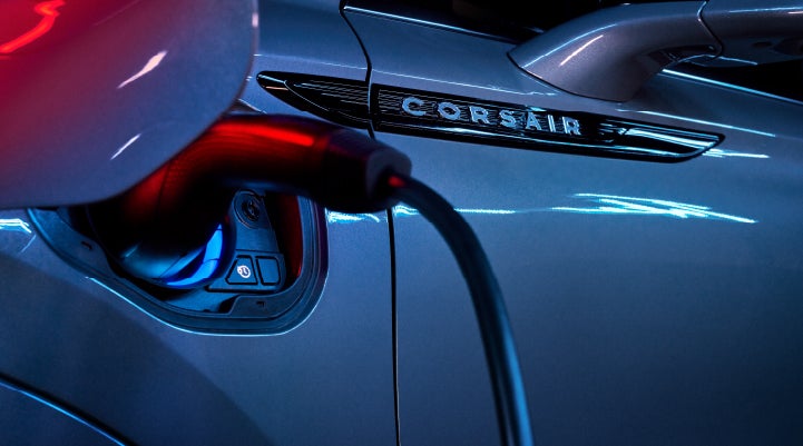 A charger plugged into the charging port of a 2024 Lincoln Corsair® Plug-in Hybrid model. | Haldeman Lincoln in Allentown PA