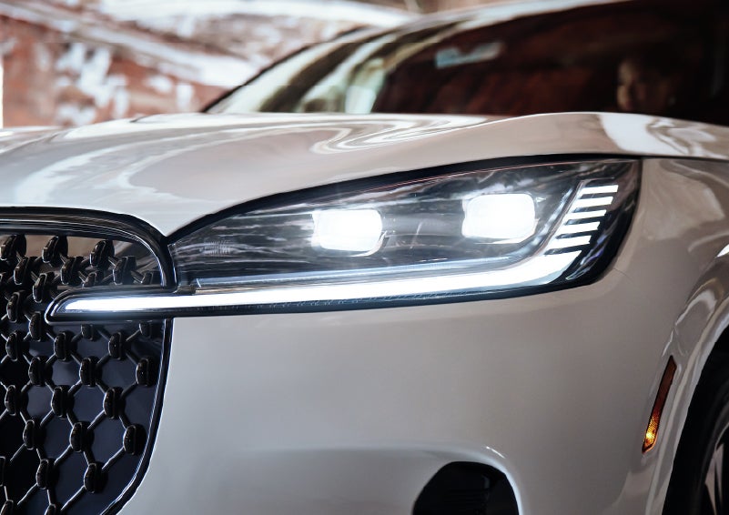 A close-up of a headlamp on the 2026 Lincoln Aviator® SUV is shown. | Haldeman Lincoln in Allentown PA