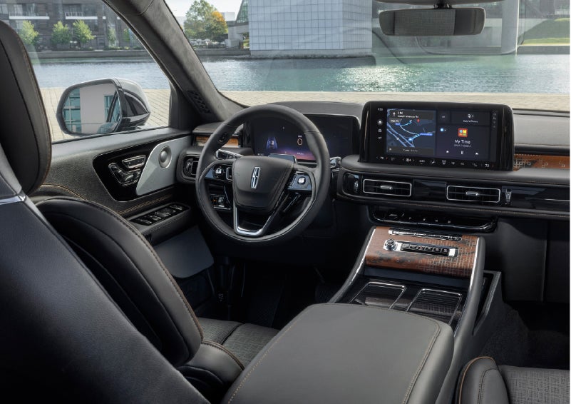The interior of the 2026 Lincoln Aviator® SUV is shown parked with a view of a harbor through the windshield. | Haldeman Lincoln in Allentown PA