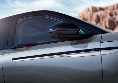 Blue lettering on the side of the vehicle that reads Nautilus indicates the available Hybrid Powertrain. | Haldeman Lincoln in Allentown PA