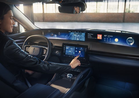 The driver of a 2026 Lincoln Nautilus® SUV interacts with the center touchscreen. | Haldeman Lincoln in Allentown PA