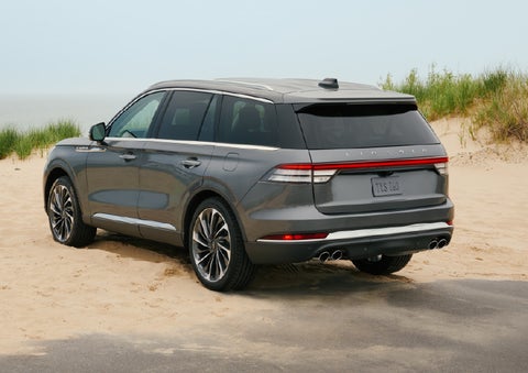 A 2027 Lincoln Aviator® SUV is parked next to sand dunes. | Haldeman Lincoln in Allentown PA
