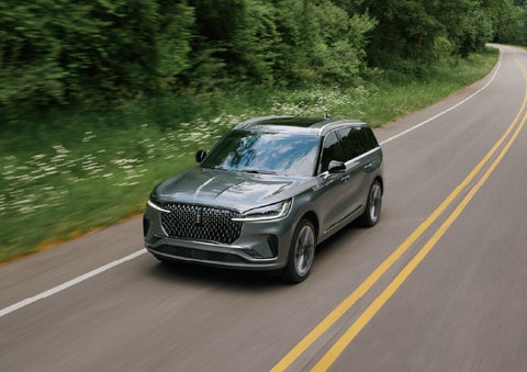 A 2027 Lincoln Aviator® SUV is being driven down a road. | Haldeman Lincoln in Allentown PA