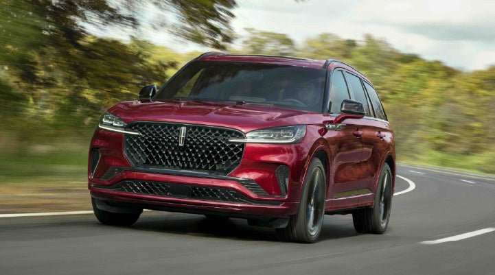 A 2027 Lincoln Aviator® SUV is being driven on a country road | Haldeman Lincoln in Allentown PA