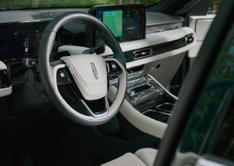 The leather-trimmed steering wheel of a 2027 Lincoln Aviator® Black Label™ SUV. | Haldeman Lincoln in Allentown PA