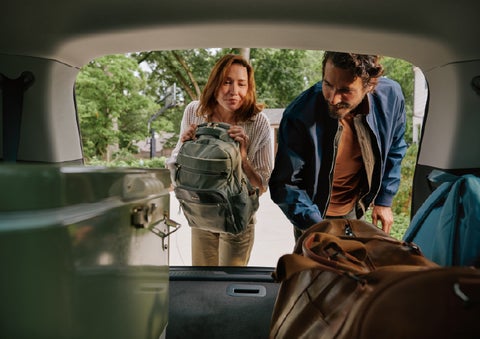 A couple loads luggage into the rear of a 2027 Lincoln Aviator® Black Label™ SUV..e 202 | Haldeman Lincoln in Allentown PA